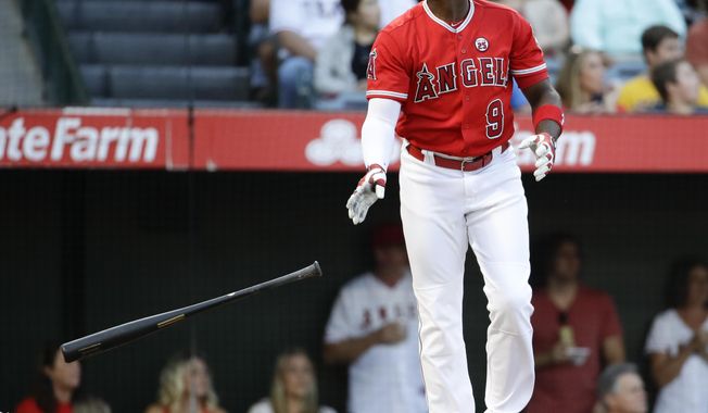 FILE - In this Sept. 16, 2017, file photo, Los Angeles Angels&#x27; Justin Upton watches his home run against the Texas Rangers during the first inning of a baseball game, in Anaheim, Calif. Outfielder Justin Upton is staying with the Angels, agreeing to a new five-year, $106 million contract. The Angels announced the deal Thursday, Nov. 2, 2017, with Upton, their late-season trade acquisition. (AP Photo/Chris Carlson, File)