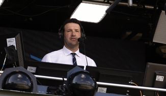In this Sept. 24, 2017, file photo, Tony Romo sits in the broadcast booth during the first half of an NFL football game between the Green Bay Packers and the Cincinnati Bengals in Green Bay, Wis. Romo, the Dallas franchise leader in passing yards and touchdowns, will soon call his first Cowboys game as the lead analyst for CBS. (AP Photo/Mike Roemer, File)
