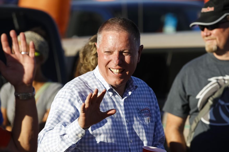 FILE - In this Sept. 6, 2014 file photo, Idaho Democratic gubernatorial candidate A.J. Balukoff greets football fans before a college football game in Boise, Idaho. The businessman and partner in the Idaho Steelheads hockey franchise has once again filed to run for Idaho governor as a Democratic candidate in 2018. Balukoff previously put up nearly $3 million of his own money to run for the same office in 2014. (AP Photo/Otto Kitsinger, File)