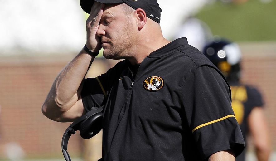 FILE - In this Saturday, Oct. 21, 2017, file photo, Missouri head coach Barry Odom watches from the sidelines during the first half of an NCAA college football game against the Idaho in Columbia, Mo. The Tigers, winless in SEC play this season, will try and change that conference identity when they host struggling Florida on Saturday. (AP Photo/Jeff Roberson, File)