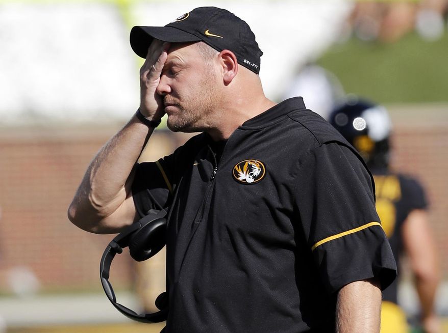 FILE - In this Saturday, Oct. 21, 2017, file photo, Missouri head coach Barry Odom watches from the sidelines during the first half of an NCAA college football game against the Idaho in Columbia, Mo. The Tigers, winless in SEC play this season, will try and change that conference identity when they host struggling Florida on Saturday. (AP Photo/Jeff Roberson, File)