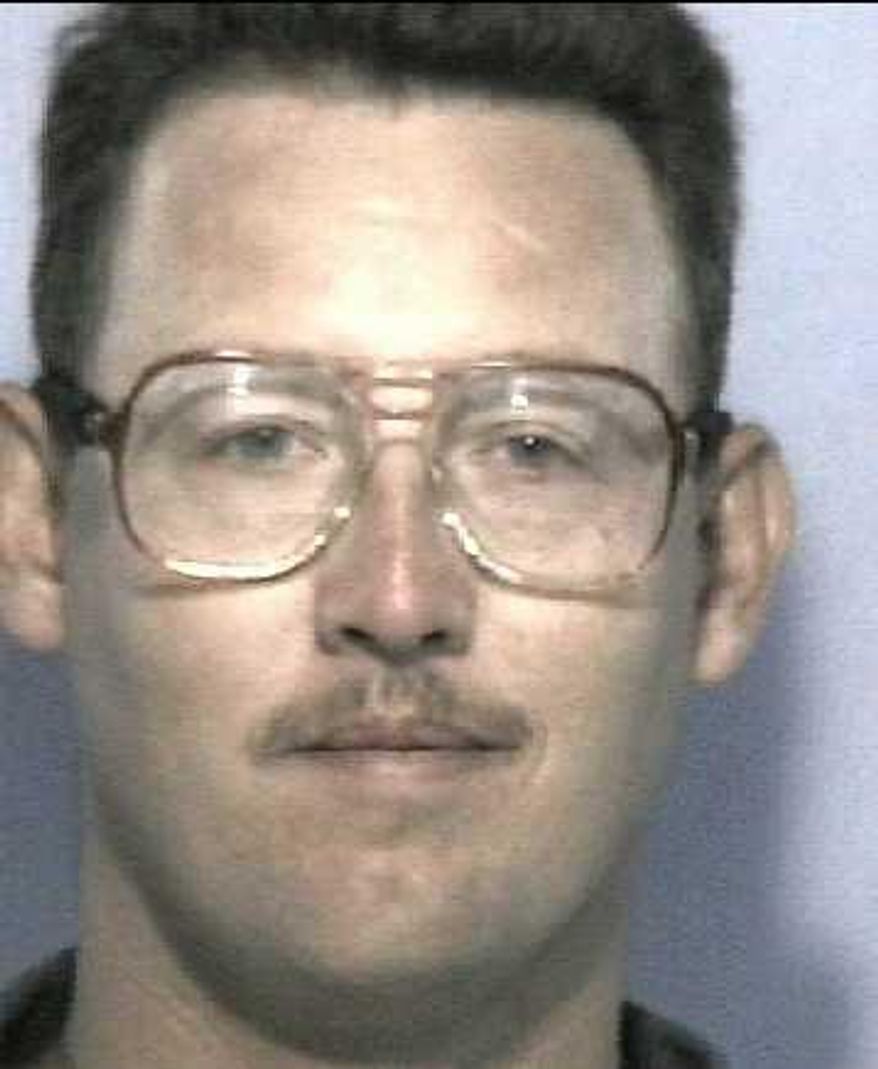 This undated photo released by the Georgia Department of Corrections shows Mark Jason Jones. Georgia's highest court says Jones and two other U.S. servicemen who have been in prison for 25 years for a racially-motivated murder are entitled to a new trial. A unanimous Georgia Supreme Court opinion published Thursday, Nov. 2, 2017, says state prosecutors improperly withheld evidence that would have helped the men's defense. (Georgia Department of Corrections via AP)