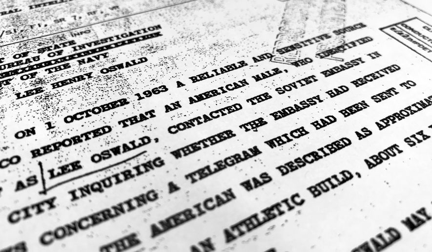 Part of a file from the CIA, dated Oct. 10, 1963, details "a reliable and sensitive source in Mexico" report of Lee Harvey Oswald's contact with the Soviet Union embassy in Mexico City, that was released for the first time on Friday, Nov. 3, 2017, by the National Archives. Documents show U.S. officials scrambling after the assassination of President John F. Kennedy to round up information about Lee Harvey Oswald's trip to Mexico City weeks earlier. (AP Photo/Jon Elswick)
