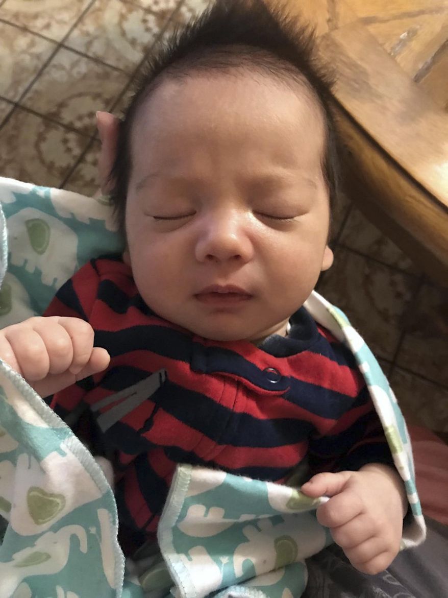 This undated photo released by the Los Angeles County Sheriff's Department shows two-month-old Jefferson Gomes, the subject of a Southern California Amber Alert. Authorities say his father, Jeffrey Michael Gomes, a 42-year-old man of Asian descent, has abducted his son and is considered armed and dangerous. The alert says the father and baby were last seen Friday afternoon, Nov. 3, 2017, in Fort Tejon, an area on the Grapevine section of Interstate 5 about halfway between Los Angeles and Bakersfield. (Los Angeles County Sheriff's Department via AP)