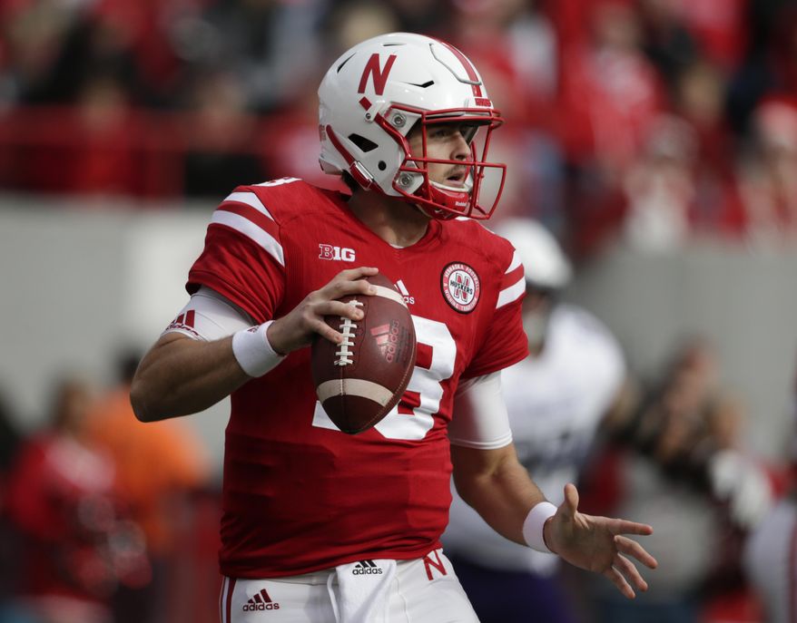 Nebraska quarterback Tanner Lee (13) looks for a receiver during the first half of an NCAA college football game against Northwestern in Lincoln, Neb., Saturday, Nov. 4, 2017. (AP Photo/Nati Harnik)