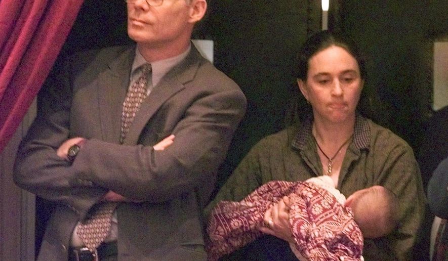 FILE - In this March 15, 2000 file photo, Vermont Auditor of Accounts Ed Flanagan, left, watches the debate on same sex marriage next to Nina Beck, and her son, Seth, at the Vermont Statehouse in Montpelier, Vt. Flanagan, credited as the first openly gay lawmaker in the country elected to statewide office has died, he was 66. . Vermont Democratic State Rep. Mary Sullivan said she had planned to visit Flanagan on Friday, Nov. 3, 2017, but arrived shortly after his death. (AP Photo/Toby Talbot, File)