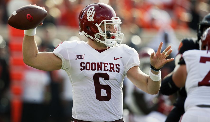 Oklahoma quarterback Baker Mayfield (6) throws in the first half of an NCAA college football game against Oklahoma State in Stillwater, Okla., Saturday, Nov. 4, 2017. (AP Photo/Sue Ogrocki)