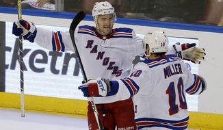 New York Rangers defenseman Kevin Shattenkirk (22) celebrates his game-winning goal with teammate J.T. Miller (10) over the Florida Panthers in an NHL hockey game, Saturday, Nov. 4, 2017, in Sunrise, Fla. The Rangers won the game 5-4. (AP Photo/Joe Skipper)