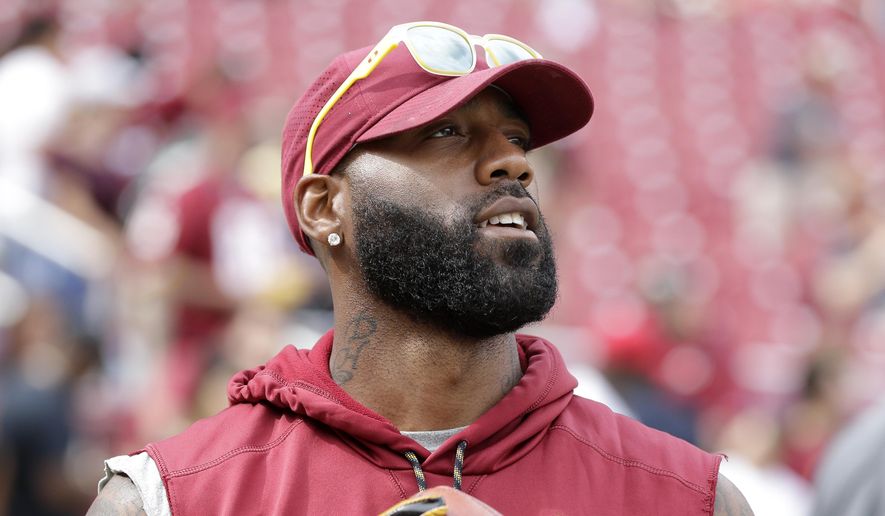 In this Aug. 27, 2017, file photo, Washington Redskins&#39; DeAngelo Hall stands on the field as players warm up for a preseason NFL football game between the Cincinnati Bengals and the Redskins in Landover, Md. (AP Photo/Mark Tenally, File) **FILE**