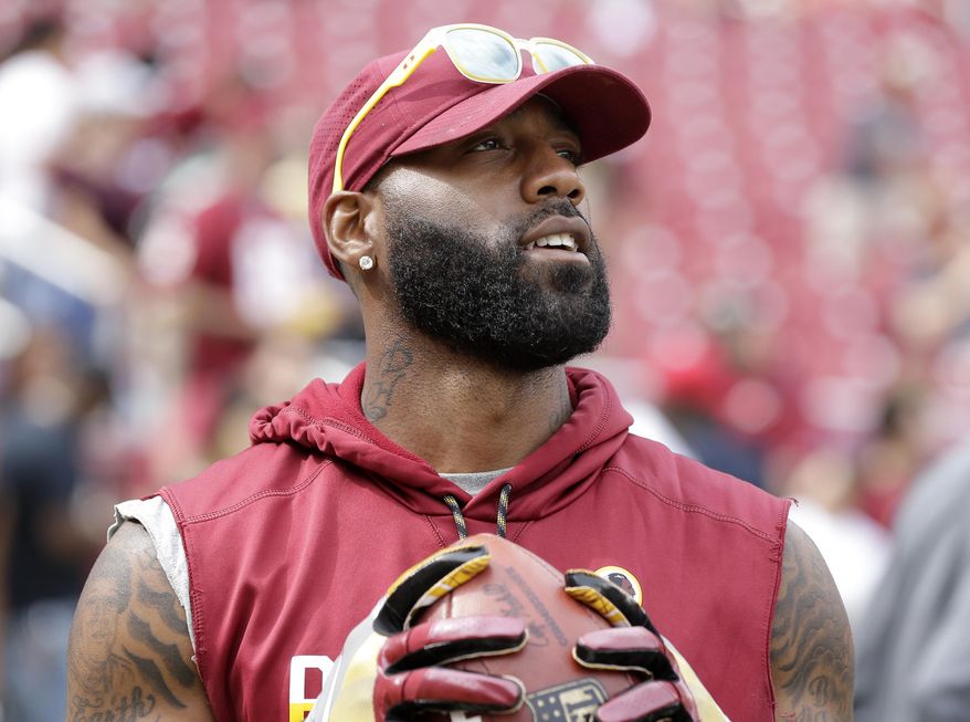 In this Aug. 27, 2017, file photo, Washington Redskins&#39; DeAngelo Hall stands on the field as players warm up for a preseason NFL football game between the Cincinnati Bengals and the Redskins in Landover, Md. (AP Photo/Mark Tenally, File) **FILE**