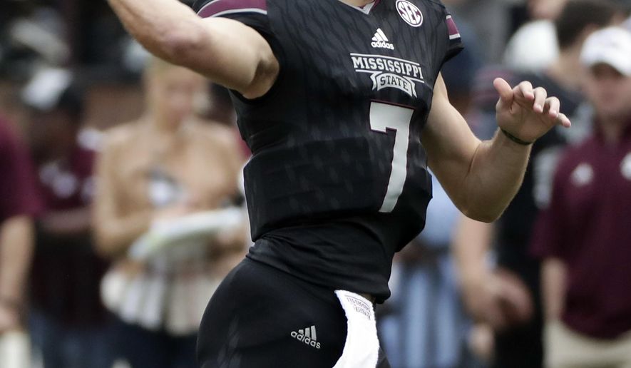 Mississippi State quarterback Nick Fitzgerald (7) readies to pass against Massachusetts during the first half of an NCAA college football game in Starkville, Miss., Saturday, Nov. 4, 2017. (AP Photo/Rogelio V. Solis)