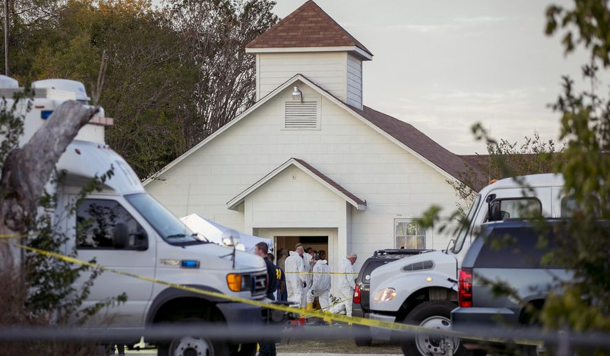 Investigators work at the scene of a deadly shooting at the First Baptist Church in Sutherland Springs, Texas, Sunday Nov. 5, 2017. A man opened fire inside of the church in the small South Texas community on Sunday, killing more than 20 people. (Jay Janner/Austin American-Statesman via AP)