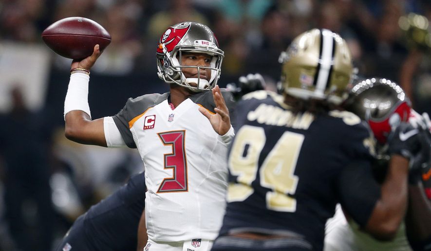 Tampa Bay Buccaneers quarterback Jameis Winston (3) passes under pressure from New Orleans Saints defensive end Cameron Jordan (94) in the first half of an NFL football game in New Orleans, Sunday, Nov. 5, 2017. (AP Photo/Butch Dill)