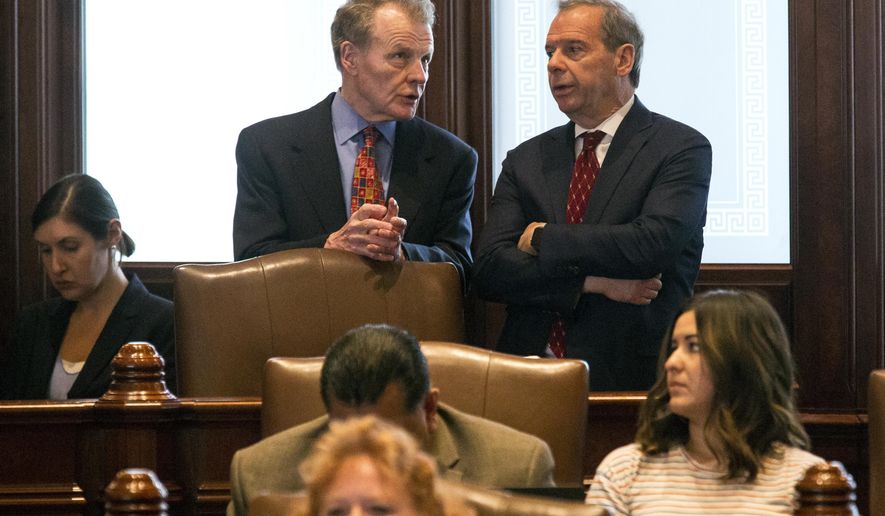 FILE - In this July 4, 2017, file photo, Illinois House Speaker Michael Madigan, D-Chicago, left, and Senate President John Cullerton, D-Chicago, talk on the Senate floor at the Capitol in Springfield, Ill. After Denise Rotheimer testified on Oct. 31, 2017, that Illinois State Sen. Ira Silverstein, D-Chicago, sexually harassed her last year, Madigan plans to call legislation requiring sexual-harassment awareness training for everyone working in the Illinois state Capitol this week. (Rich Saal/The State Journal-Register via AP)