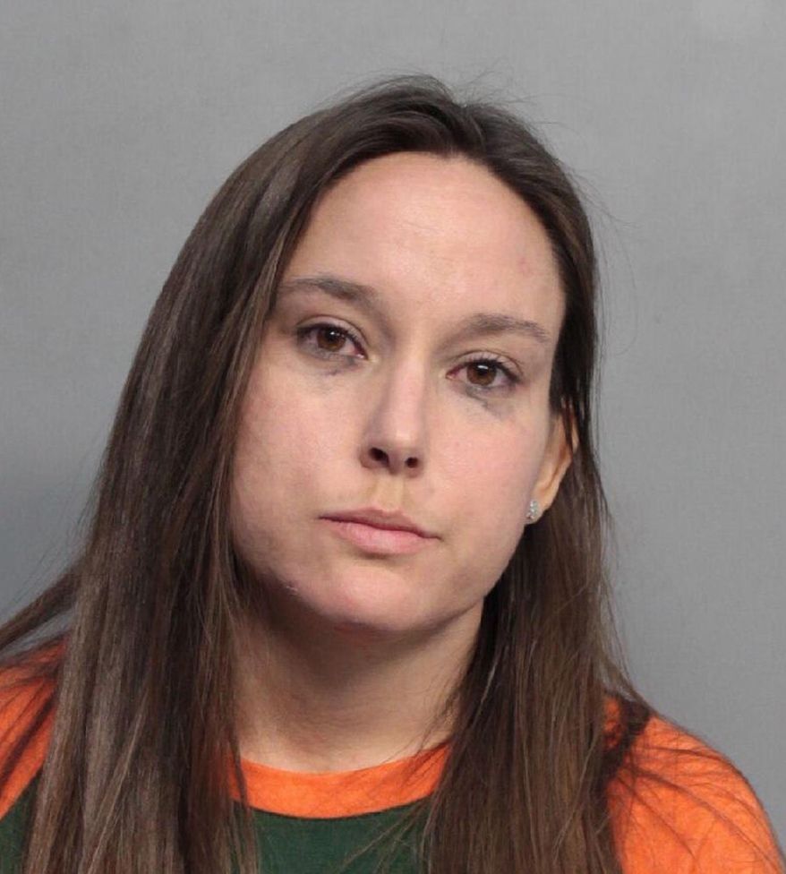 Bridget Freitas is seen in an undated photo provided by the Miami-Dade Police Department. Police have charged Freitas, a 30-year-old nurse, with felony battery on a police officer for her part in a videotaped altercation with a detective at a University of Miami football game. Police said Bridget Freitas slapped an officer while being carried out during Miami's win Saturday, Nov. 4, 2017, over Virginia Tech at Hard Rock Stadium. (Miami-Dade Police Department via AP)