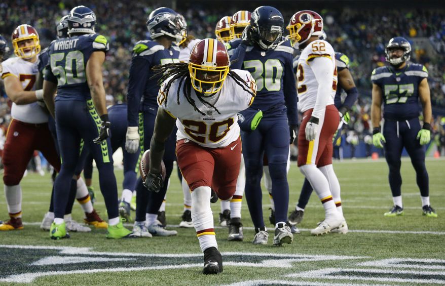 Washington Redskins running back Rob Kelley gets up after scoring a touchdown against the Seattle Seahawks in the second half of an NFL football game, Sunday, Nov. 5, 2017, in Seattle. The Redskins won 17-14. (AP Photo/Elaine Thompson)