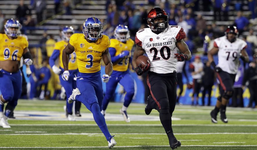 San Diego State running back Rashaad Penny (20) rushes for a touchdown past San Jose State cornerback Jermaine Kelly (3) during the second half of an NCAA college football game Saturday, Nov. 4, 2017, in San Jose, Calif. (AP Photo/Marcio Jose Sanchez)