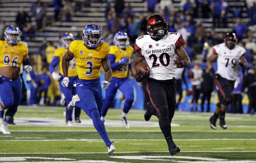 San Diego State running back Rashaad Penny (20) rushes for a touchdown past San Jose State cornerback Jermaine Kelly (3) during the second half of an NCAA college football game Saturday, Nov. 4, 2017, in San Jose, Calif. (AP Photo/Marcio Jose Sanchez)