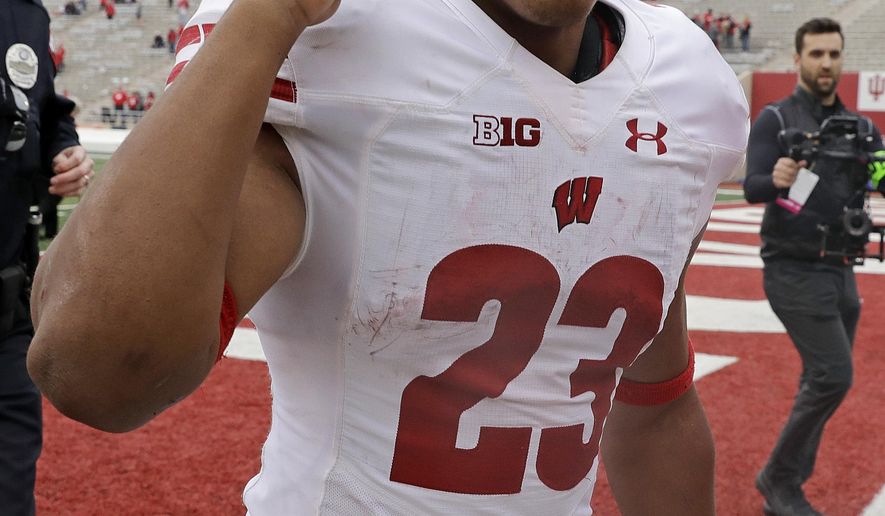 Wisconsin running back Jonathan Taylor reacts to fans as he runs off the field following an NCAA college football game against Indiana, Nov. 4, 2017, in Bloomington, Ind. Wisconsin won 45-17. (AP Photo/Darron Cummings)