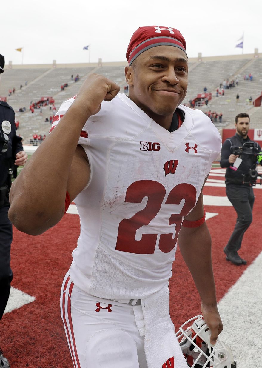 Wisconsin running back Jonathan Taylor reacts to fans as he runs off the field following an NCAA college football game against Indiana, Nov. 4, 2017, in Bloomington, Ind. Wisconsin won 45-17. (AP Photo/Darron Cummings)