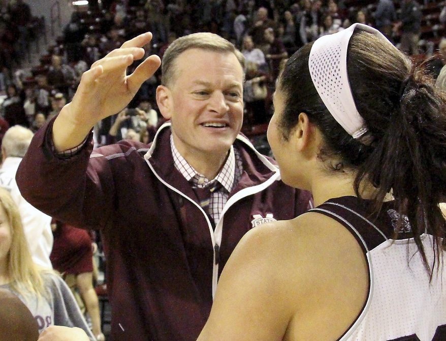 FILE - In this Jan. 28, 2016, file photo, Mississippi State athletic director Scott Stricklin congratulates Dominique Dillingham following the team's NCAA college basketball game against Tennessee in Starkville, Miss. Florida’s next coach will have quite a mess to clean up on both sides of the ball. The Gators don’t appear to have to a capable quarterback on the roster and now have the program’s worst scoring defense in more than 70 years. Florida athletic director Scott Stricklin vowed to hire someone who will the football program fun again. The safe assumption is that means Stricklin will hire a head coach with an offensive background, Monday, Nov. 6, 2017. (AP Photo/Jim Lytle, File)