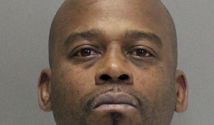 This undated photo released by the Santa Clara County Department of Corrections shows John Bivins. Authorities say two jail inmates, Bivins and Tramel McClough, escaped from a suburban Silicon Valley courthouse in a waiting vehicle on Monday, Nov. 6, 2017 while attending a hearing related to an armed robbery they are charged with. (Santa Clara County Department of Corrections via AP)