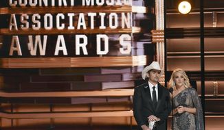 FILE - This Nov. 2, 2016 file photo shows hosts Brad Paisley, left, and Carrie Underwood at the 50th annual CMA Awards in Nashville, Tenn. The 51st annual CMA Awards will air live on Wednesday. (Photo by Charles Sykes/Invision/AP, File)