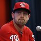 FILE - In this Oct. 12, 2017 file photo, Washington Nationals catcher Matt Wieters listens to a question during a media availability before Game 5 of baseball&#39;s National League Division Series against the Chicago Cubs at Nationals Park, in Washington. Wieters is exercising his $10.5 million contract option for next season with the Washington Nationals.  (AP Photo/Alex Brandon)