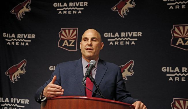 FILE - In this July 13, 2017, file photo, Rick Tocchet, the new coach of the Arizona Coyotes, speaks during a news conference in Glendale, Ariz. Tocchet will get his third Pittsburgh Penguins Stanley Cup ring, second as an assistant coach after one as a player, when he visits as coach of the Arizona Coyotes on Tuesday night, Nov. 7, 2017. (AP Photo/Ross D. Franklin, File)