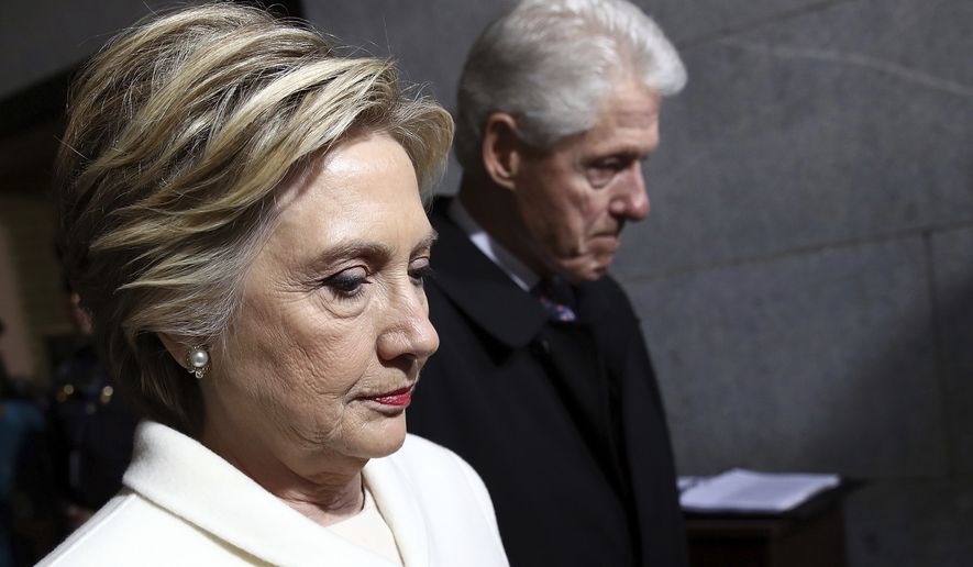 FILE - In this Jan. 20, 2017, file photo, former Sen. Hillary Clinton and former President Bill Clinton arrive on the West Front of the U.S. Capitol on Friday, Jan. 20, 2017, in Washington, for the inauguration ceremony of Donald J. Trump as the 45th president of the United States. Time has not healed the Democratic party’s wounds. On Election Day 2016, Democrats suffered a devastating and shocking loss. A year later, they’re still sorting through the wreckage. The infighting, the divisive personalities and the questions about how it happened are still front and center, threatening to hold the party back in elections on Tuesday and into next year’s midterms. (Win McNamee/Pool Photo via AP, File)