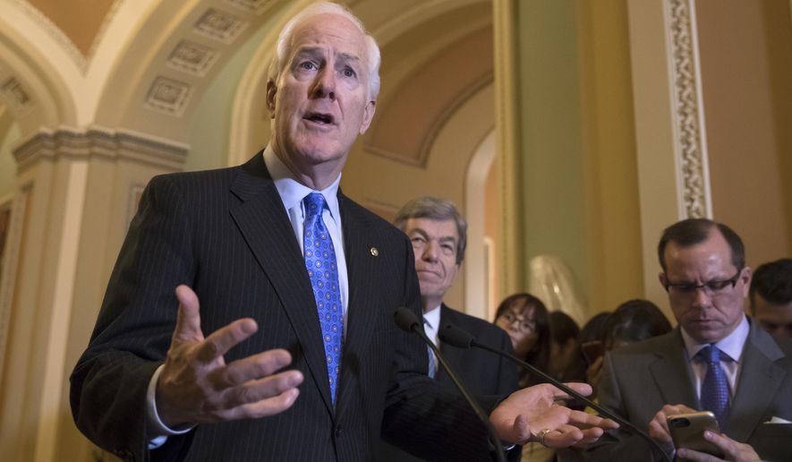 Majority Whip John Cornyn, R-Texas, joined at right by Sen. Roy Blunt, R-Mo., answers a question about the mass shooting at a Texas church this week, during a news conference on Capitol Hill in Washington, Tuesday, Nov. 7, 2017. (AP Photo/J. Scott Applewhite) **FILE**