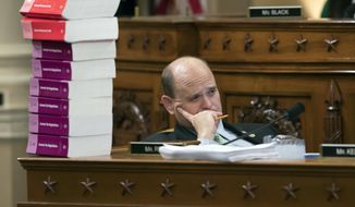 Rep. Tom Reed, R-N.Y., listens as he sits next to a stack of IRS Code volumes as the House Ways and Means Committee begins the markup process of the GOP&#39;s far-reaching tax overhaul, on Capitol Hill in Washington, Monday, Nov. 6, 2017. (AP Photo/J. Scott Applewhite) ** FILE **