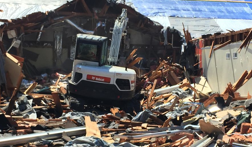 In this Sept. 17, 2017 photo, a worker uses machinery to clear away debris from Rockport First Assembly of God Church in Rockport, Texas. The church, which was hit by Hurricane Harvey, has filed a lawsuit against the Federal Emergency Management Agency. FEMA is rethinking a policy that routinely denies aid to religious institutions if the money will be used to rebuild sanctuaries damaged or destroyed in natural disasters. (Photo Courtesy/Bruce Frazier via AP)
