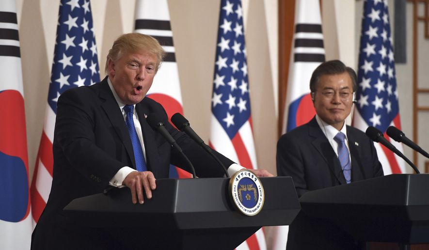 U.S. President Donald Trump, left, speaks as South Korean President Moon Jae-In listens during a joint press conference at the presidential Blue House in Seoul, South Korea, Tuesday, Nov. 7, 2017. (Jung Yeon-Je/Pool Photo via AP) ** FILE **