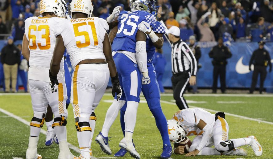 FILE - In this Oct. 28, 2017, file photo, Kentucky defensive end Denzil Ware (35) celebrates after sacking Tennessee quarterback Jarrett Guarantano in an NCAA college football game in Lexington, Ky. Kentucky won the game 29-26. Tennessee entered the season believing the depth of its offensive line was one of its biggest strengths. It hasn't worked out that way. (AP Photo/David Stephenson, File)