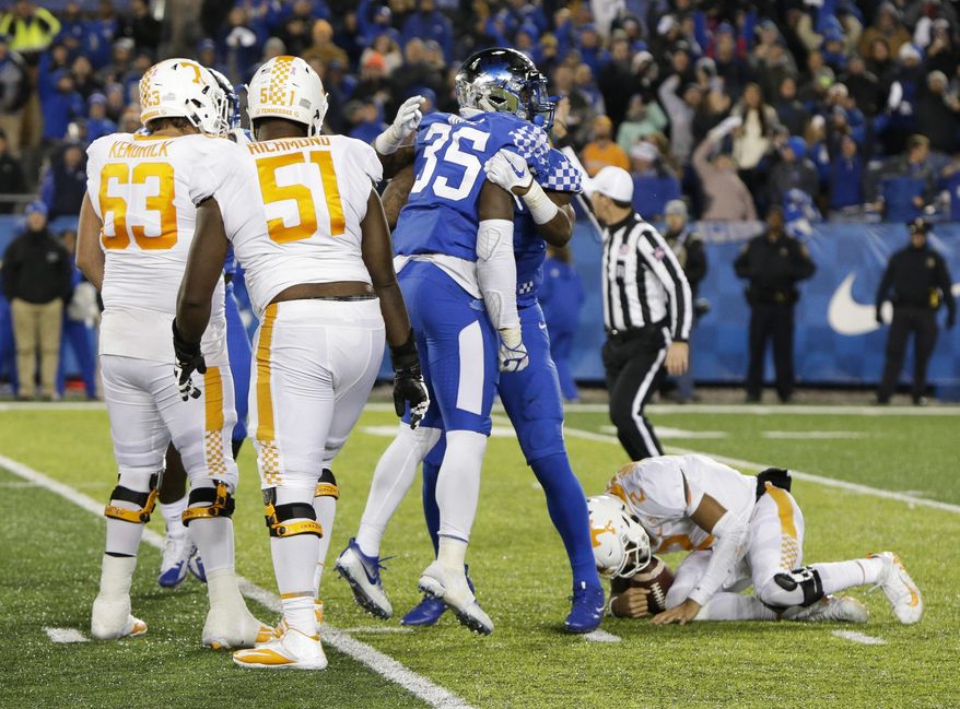 FILE - In this Oct. 28, 2017, file photo, Kentucky defensive end Denzil Ware (35) celebrates after sacking Tennessee quarterback Jarrett Guarantano in an NCAA college football game in Lexington, Ky. Kentucky won the game 29-26. Tennessee entered the season believing the depth of its offensive line was one of its biggest strengths. It hasn't worked out that way. (AP Photo/David Stephenson, File)