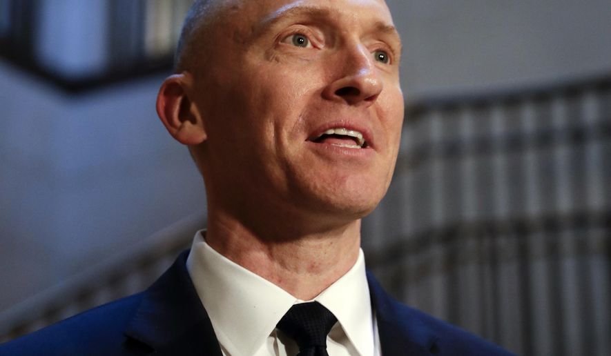 In this Nov. 2, 2017, photo, Carter Page, a foreign policy adviser to Donald Trump&#39;s 2016 presidential campaign, speaks with reporters following a day of questions from the House Intelligence Committee, on Capitol Hill in Washington. (AP Photo/J. Scott Applewhite)
