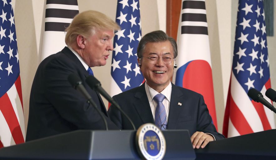 President Donald Trump, left, speaks as South Korean President Moon Jae-in looks on during a joint news conference at the Blue House in Seoul, South Korea, Tuesday, Nov. 7, 2017. (AP Photo/Andrew Harnik) ** FILE **