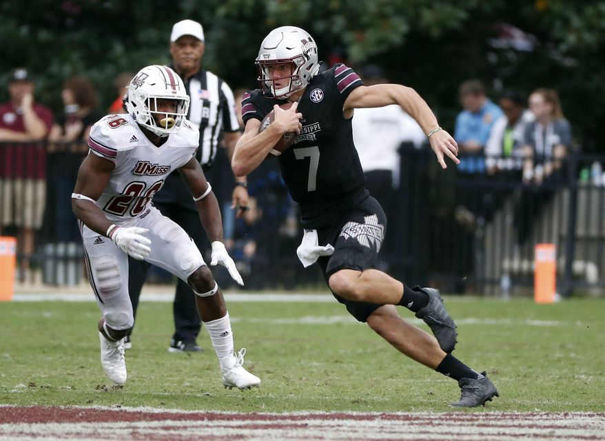Mississippi State quarterback Nick Fitzgerald (7) runs for a first down past Massachusetts linebacker Jarell Addo (26) in the second half of an NCAA college football game against in Starkville, Miss., Saturday, Nov. 4, 2017. No. 21 Mississippi State won 34-23. (AP Photo/Rogelio V. Solis)
