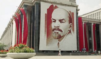A poster of Vladimir Lenin, founder of the Soviet state, hangs on a wall of the Moscow library. (Associated Press/File)