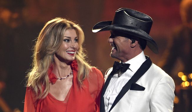 Faith Hill, left, and Tim McGraw perform &quot;The Rest of Our Life&quot; at the 51st annual CMA Awards at the Bridgestone Arena on Wednesday, Nov. 8, 2017, in Nashville, Tenn. (Photo by Chris Pizzello/Invision/AP)