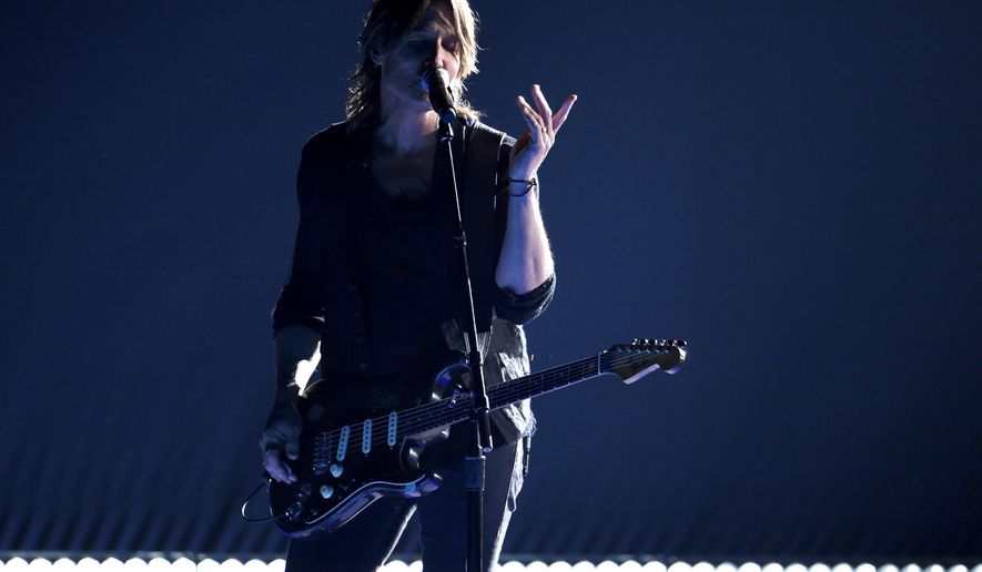 Keith Urban performs &amp;quot;Female&amp;quot; at the 51st annual CMA Awards at the Bridgestone Arena on Wednesday, Nov. 8, 2017, in Nashville, Tenn. (Photo by Chris Pizzello/Invision/AP)