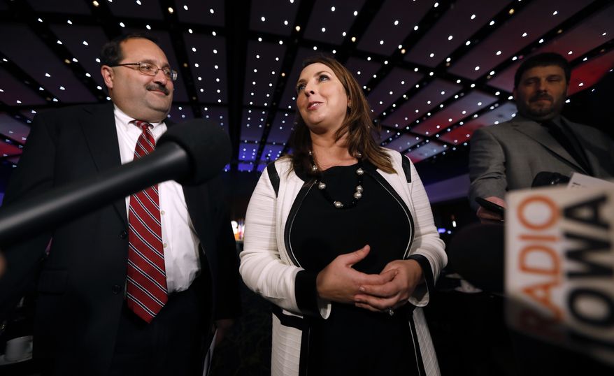 Republican National Committee Chairwoman Ronna Romney McDaniel speaks to reporters as Republican Party of Iowa Chairman Jeff Kaufmann, left, looks on before the Republican Party of Iowa's annual Reagan Dinner, Wednesday, Nov. 8, 2017, in Des Moines, Iowa. (AP Photo/Charlie Neibergall) ** FILE **