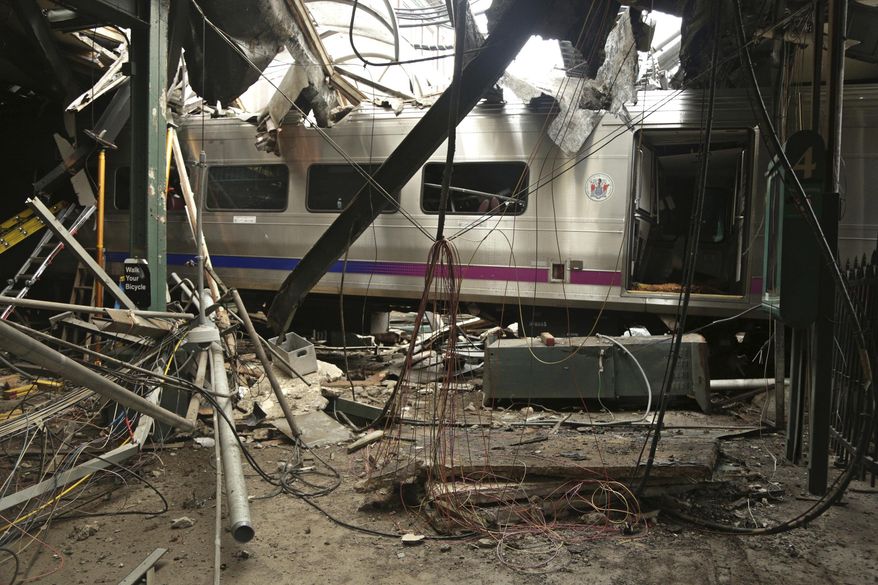 FILE – This Oct. 1, 2016, file photo provided by the National Transportation Safety Board shows damage from a Sept. 29, 2016, commuter train crash that killed a woman and injured more than 100 people at the Hoboken Terminal in Hoboken, N.J. More than 40 New Jersey Transit train engineers have been sidelined because testing imposed after a deadly rail crash found they suffered from sleep apnea, Wednesday, Nov. 8, 2017. (Chris O'Neil/National Transportation Safety Board via AP, File)