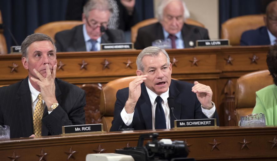 Rep. David Schweikert, R-Ariz., joined at left by Rep. Tom Rice, R-S.C., makes a point as the House Ways and Means Committee continues its debate over the Republican tax reform package, on Capitol Hill in Washington, Wednesday, Nov. 8, 2017. (AP Photo/J. Scott Applewhite)
