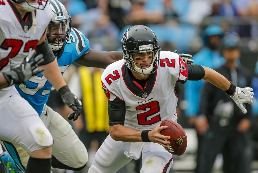 FILE - In this Sunday, Nov. 5, 2017, file photo, Carolina Panthers' Mario Addison (97) gets a jump on Atlanta Falcons' Matt Ryan (2) for a sack during the second half of an NFL football game in Charlotte, N.C. Falcons coach Dan Quinn says he’s looking for signs his Falcons players’ confidence has been shaken by losses in four of five games. After Atlanta was held to no more than 17 points in any of the losses, there may be reason to be especially concerned about the morale of his team’s players on offense. (AP Photo/Bob Leverone, File)