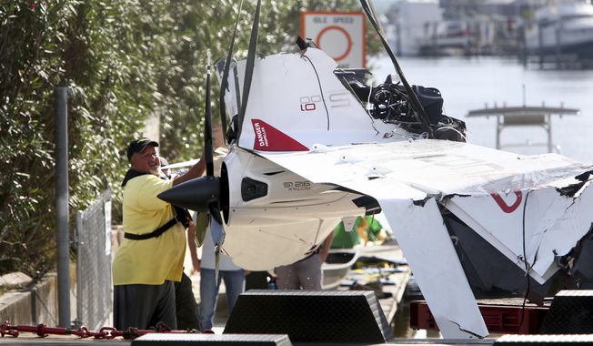 The remains of an ICON A5 ultralight airplane are moved from a boat ramp in the Gulf Harbors neighborhood of New Port Richey, Fla., on Wednesday, Nov. 8, 2017.  The private plane, which belonged to Roy Halladay had just been removed from the shallow waters off Ben Pilot Point in New Port Richey where it crashed Tuesday, killing the 40-year-old former Toronto Blue Jays and Philadelphia Phillies pitcher.   (Douglas R. Clifford/Tampa Bay Times via AP) **FILE**