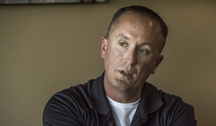 California Highway Patrol officer Chris Lutz talks at his attorney's office in Fresno on Wednesday, Oct. 25, 2017. He claims his managers in the CHP's Oakhurst office in Madera County have denied him time off for military assignments, harassed him with unfounded allegations and driven him to file a lawsuit against his employer. (Hector Amezcua/The Sacramento Bee via AP)