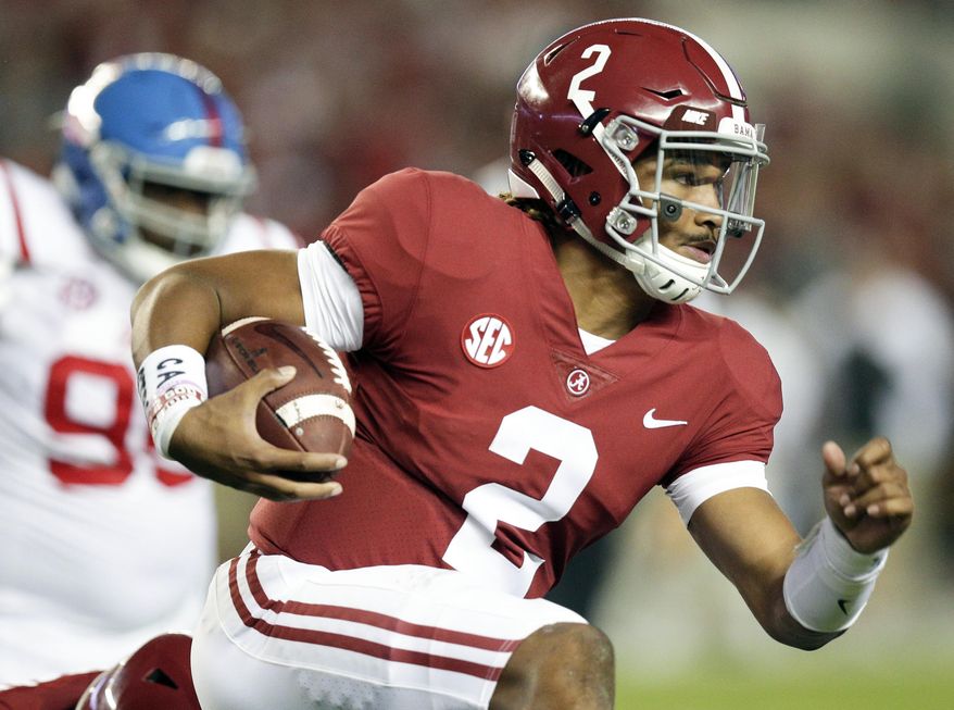 FILE- In this Sept. 30, 2017, file photo, Alabama quarterback Jalen Hurts runs the ball against Mississippi during the first half of an NCAA college football game in Tuscaloosa, Ala. The Southeastern Conference doesn't have any players putting up video game-style numbers. But, there's plenty of big games left for players like Hurts and Georgia's Nick Chubb to produce Heisman moments. (AP Photo/Brynn Anderson, File)