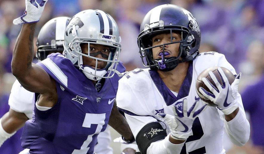 FILE - In this Oct. 14, 2017, file photo, TCU safety Niko Small (2) breaks up a pass intended for Kansas State wide receiver Isaiah Zuber (7) during the second half of an NCAA college football game, in Manhattan, Kan. (AP Photo/Charlie Riedel, File)